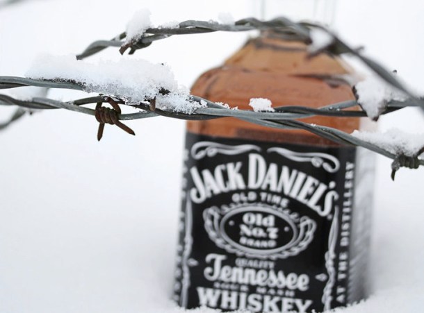 jack_daniels_in_snow_by_sp333d1-d35swbv